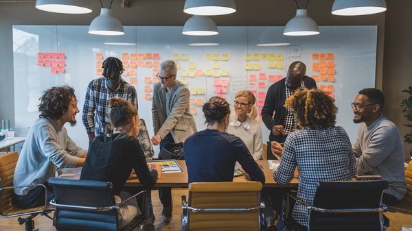 A photo of a diverse group of people working together on a project. 